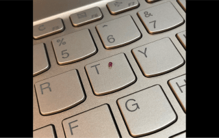 Tacmina Q-5 Microliter Class Lab Pump Tiny Check Ball Shown On Keyboard For Size Comparison